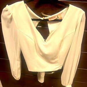 From the buckle, sexy white top, size Medium